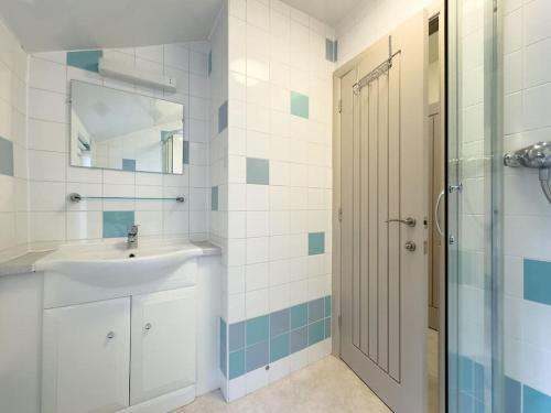 a bathroom with a sink and a shower at RIDGEMOUNT APT - Great base for walking and cycling in Keswick, Lake District National Park in Keswick