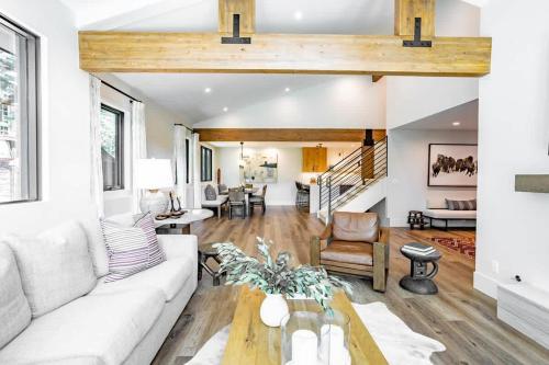 a living room with a couch and a table at Luxury Home with Vail Mountain View in Vail