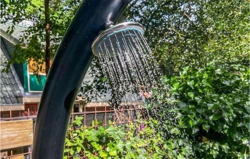 a spiderweb hanging from a pole in a playground at 2 Bedroom Gorgeous Home In Ommen in Ommen