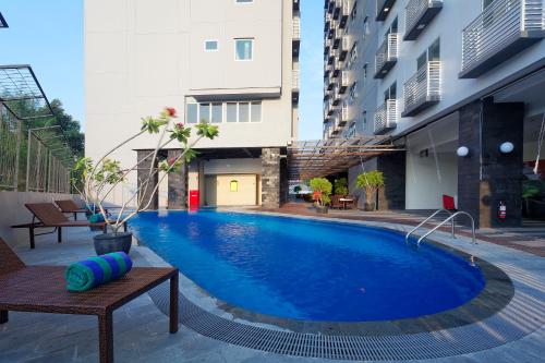 a swimming pool in the middle of a building at Nagoya Mansion Hotel and Residence in Nagoya