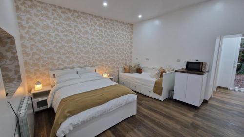 Voodi või voodid majutusasutuse Aria House toas