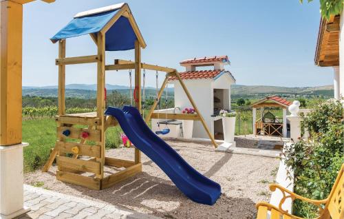 a playground with a slide and a slideintend at One-Bedroom Holiday Home In Danilo in Danilo Biranj
