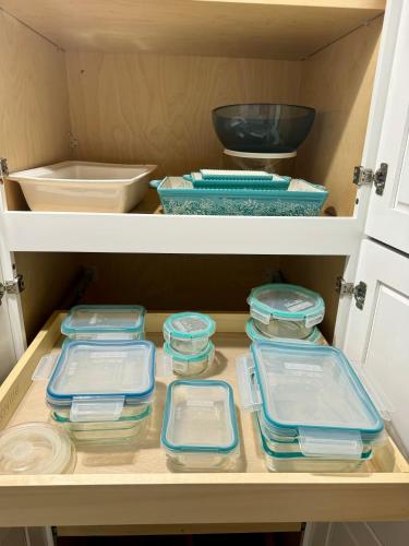 a drawer filled with bowls and plates in a refrigerator at Lakefront House With Breath Taking Views in Agoura Hills