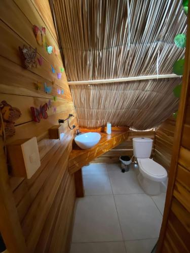 a bathroom with a sink and a toilet in it at Casa MAGGY BARU BEACH in Playa Blanca