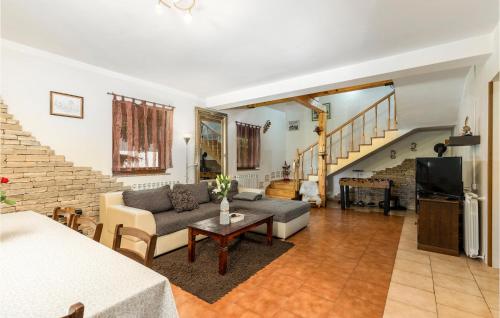 a living room with a couch and a tv at Pet Friendly Home In Vrata With Sauna in Vrata