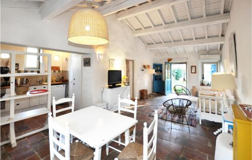 a kitchen and dining room with a table and chairs at Beautiful Home In Pech-Luna With Wi-Fi in Pech-Luna