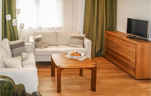 a living room with a couch and a table at Fewo Albrechtshof in Ribnitz-Damgarten