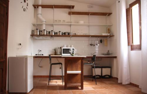 Kuchyň nebo kuchyňský kout v ubytování Lodgings in Sardinia