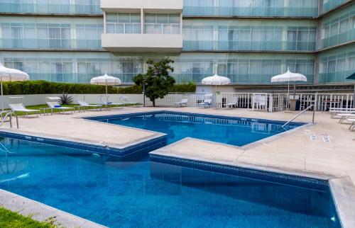 Πισίνα στο ή κοντά στο Holiday Inn Express Guadalajara Expo by IHG