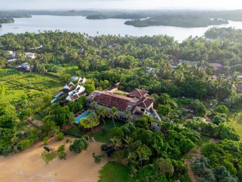 an aerial view of a house on the beach at Aditya Resort in Hikkaduwa