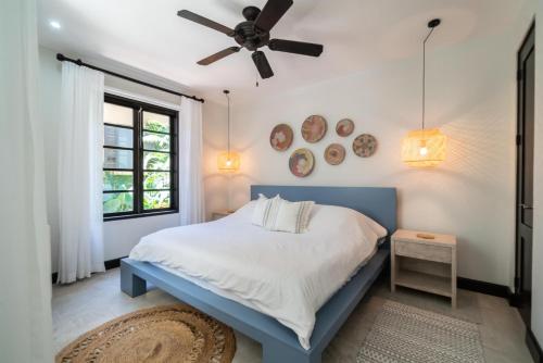 a bedroom with a bed and a ceiling fan at Calle La Ronda 18 At Las Catalinas in Playa Danta
