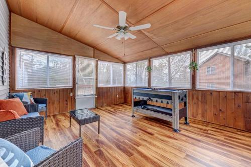 a living room with a ceiling fan and wood floors at The Gap at Poconos- Sun Room-Arcade- Game Room in Long Pond