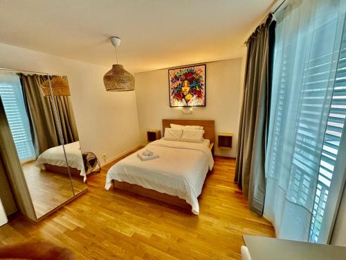 Ένα ή περισσότερα κρεβάτια σε δωμάτιο στο Great apartment in Lausanne