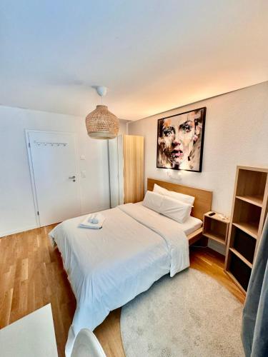 Ένα ή περισσότερα κρεβάτια σε δωμάτιο στο Great apartment in Lausanne