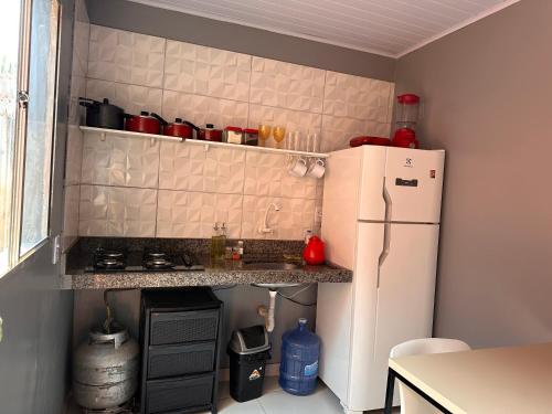 Η κουζίνα ή μικρή κουζίνα στο Casa de 2 Quartos no Centro