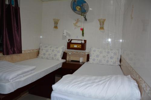 Säng eller sängar i ett rum på Everest Hostel