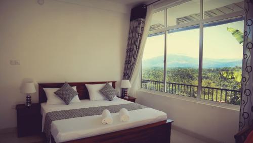 Cama o camas de una habitación en Romance Hills Hotel