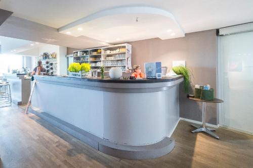 a bar in a restaurant with a counter at aussicht bio hotel restaurant cafe in Neuburg an der Donau