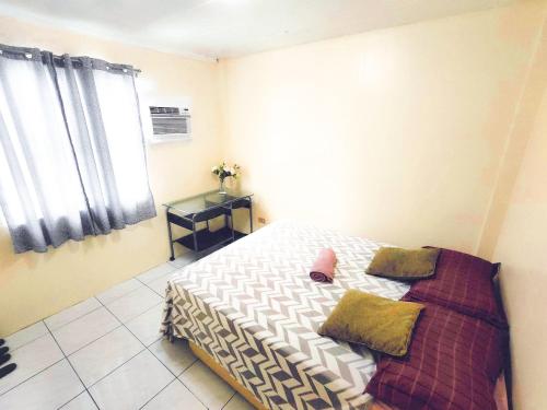 Amor Building - Urdaneta Cityにあるベッド
