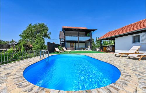 a swimming pool in the backyard of a house at Awesome Home In Zagreb With Sauna in Sesvete