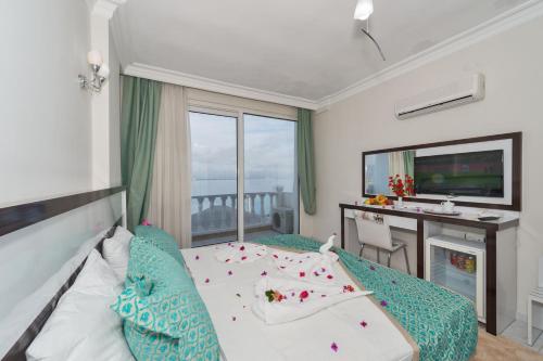 Ένα ή περισσότερα κρεβάτια σε δωμάτιο στο Otel Carpe Diem Gold