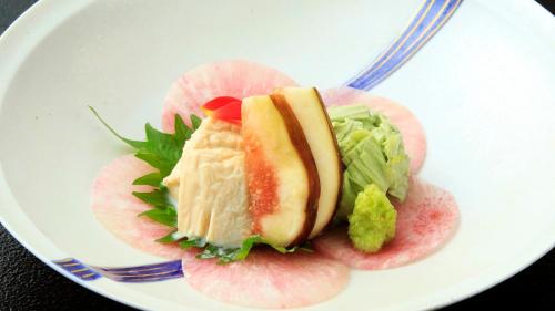 a plate with a sandwich and salad on a fork at Hotel Shikisai in Nikko