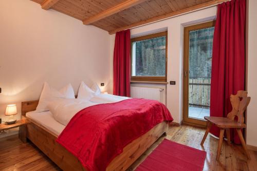 Postel nebo postele na pokoji v ubytování Stelvio Residence