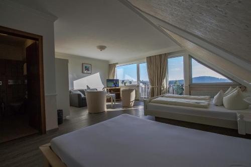 Postel nebo postele na pokoji v ubytování Hotel Schneider