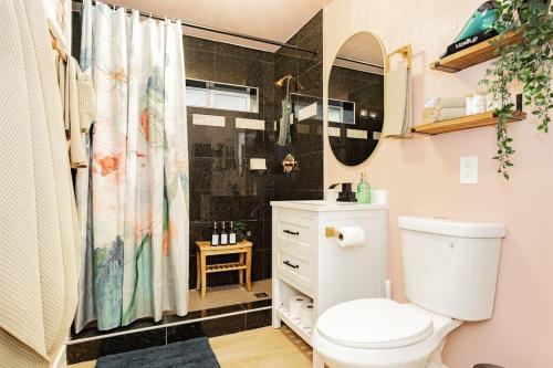 a bathroom with a toilet and a shower curtain at Star Motel ALL FIVE- Entire home in Las Vegas, Nevada, United States in Las Vegas