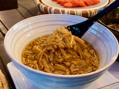 a bowl of noodles with a spoon in it at Chateraise Hotel Nagano in Nagano