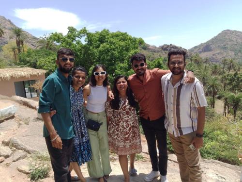 a group of people posing for a picture at Valley Nest for 6-12 PAX in Mount Ābu