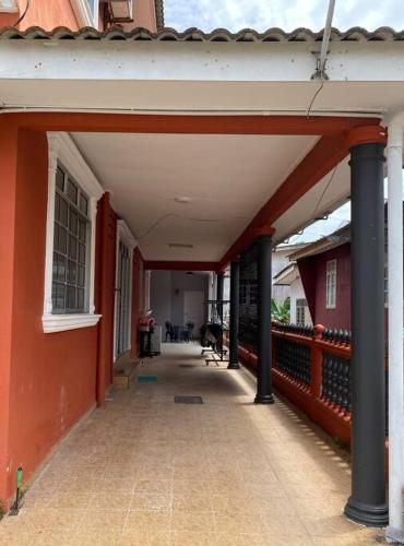 an empty hallway of a building with a porch at Peacock Studio Tiny House in Kuala Terengganu