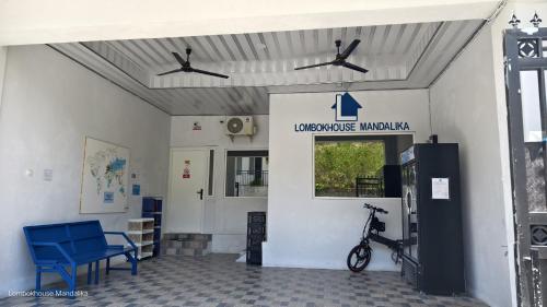 a building with a bike parked inside of it at Lombokhouse Mandalika in Kuta Lombok