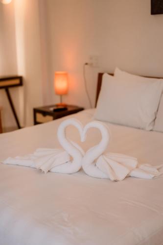 a heart made out of towels on a bed at Hue River Side Villa in Hue
