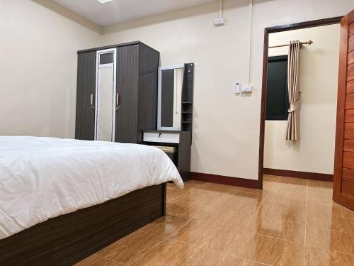 Katil atau katil-katil dalam bilik di บ้านสวยกานต์ชนิต