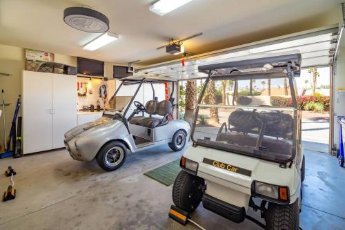 a golf cart is parked in a garage at The Country Club Experience in Palm Desert