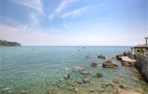 a view of the ocean with rocks in the water at Amazing Home In Staletti With Wifi in Stalettì
