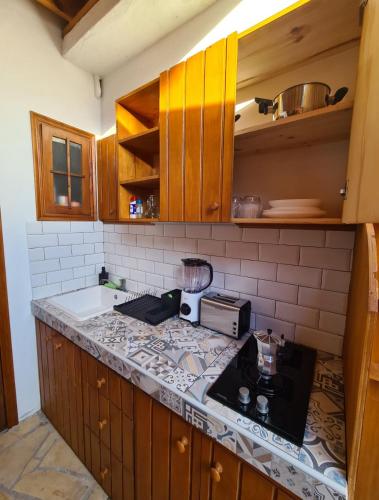 a kitchen with a counter top with a toaster oven at La Casita de Madera in El Paso