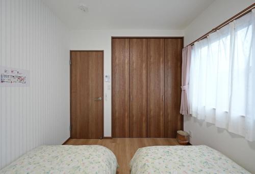 Postel nebo postele na pokoji v ubytování Fujiyama Stay102