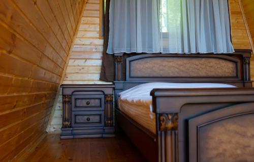 a bedroom with two beds and a window at Prime House Cottages in Keda
