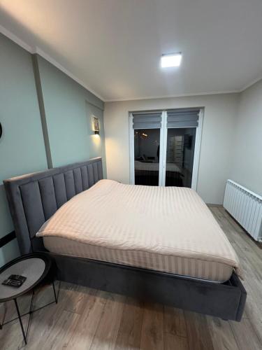 Llit o llits en una habitació de Central Oasis Apartment