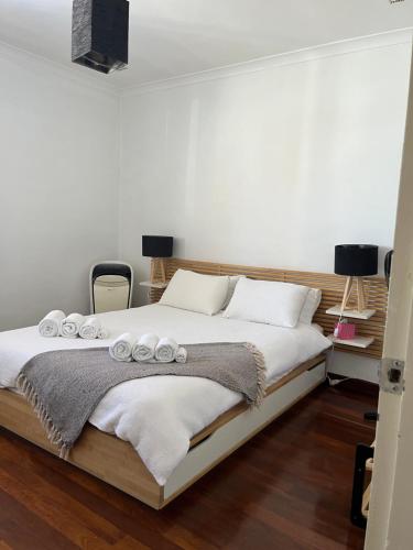 Ένα ή περισσότερα κρεβάτια σε δωμάτιο στο South Beach Holiday Home