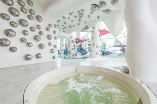 a room with a sink with a bunch of plates at Arte Plus Jalan Ampang, KLCC Level 35 in Kuala Lumpur