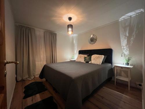 a bedroom with a bed with two pillows on it at Rent A Lovely Place - OHV3 in Osby