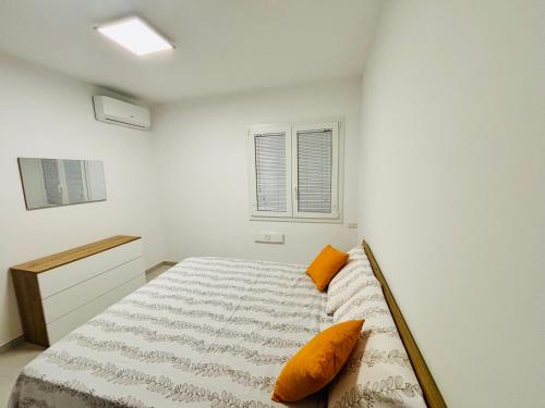 Cama o camas de una habitación en Soverato Apartments