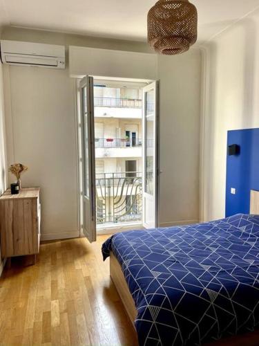 Ένα ή περισσότερα κρεβάτια σε δωμάτιο στο Appartement Niçois