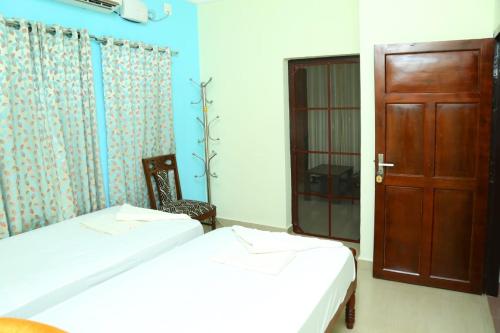 Una cama o camas en una habitación de Jasmin Villa