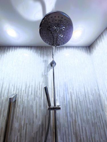 a shower head in a room with a ceiling at Super Pilgrimage Inn Karyogo A Private Retreat Just for You in Nahari