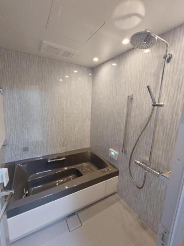 a bathroom with a sink and a shower at Super Pilgrimage Inn Karyogo A Private Retreat Just for You in Nahari