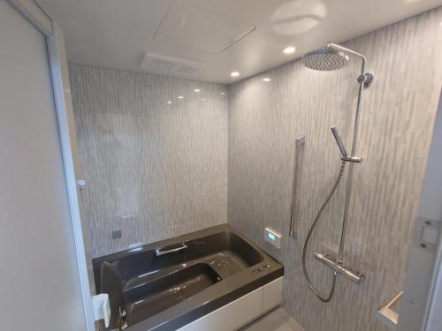 a bathroom with a shower and a sink at Super Pilgrimage Inn Karyogo A Private Retreat Just for You in Nahari